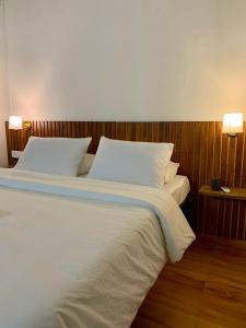 Ένα ή περισσότερα κρεβάτια σε δωμάτιο στο The Alcove Bed and Breakfast