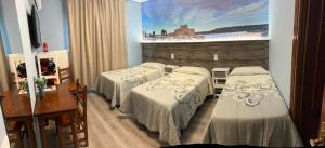 Posteľ alebo postele v izbe v ubytovaní Hostal imperio