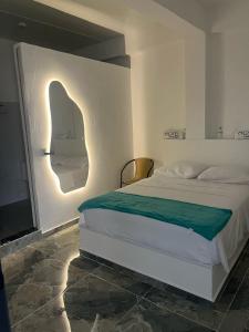 Postel nebo postele na pokoji v ubytování Hotel Guamaluno