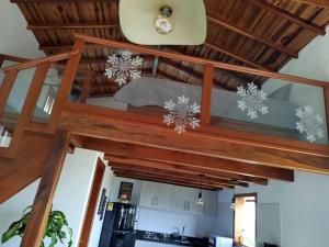 a kitchen with a wooden ceiling with snowflakes at Cabaña Assyria in Zapatoca