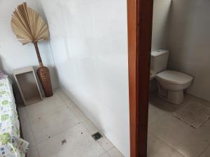 a small bathroom with a toilet and a fan at Premium Apartment Double Bedroom in Cianorte +2 photos