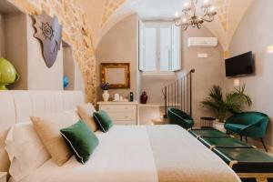 TV a/nebo společenská místnost v ubytování Relais La Casa del Poeta