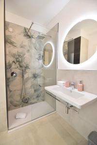 a bathroom with a sink and a shower at Casa Emma in Agerola