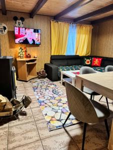 a living room with a couch and a table at Kokava Línia chata 2 in Kokava na Rimavica