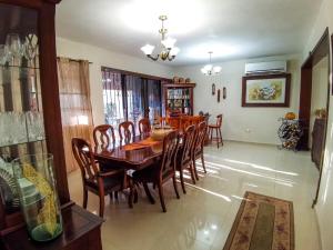 a dining room with a wooden table and chairs at Casa Arena in Cuatrociénegas de Carranza