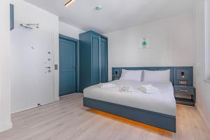 Postel nebo postele na pokoji v ubytování Tulii Rooms