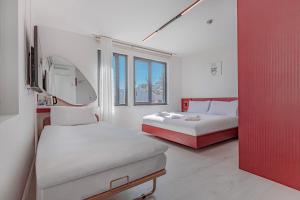 Postel nebo postele na pokoji v ubytování Tulii Rooms