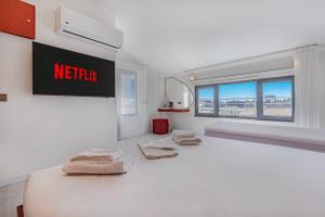 Postel nebo postele na pokoji v ubytování Tulii Rooms