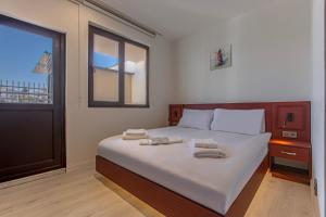 Postel nebo postele na pokoji v ubytování Tulii Rooms