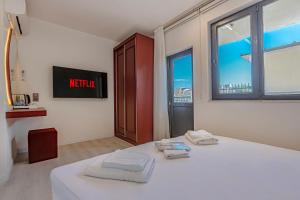 Postel nebo postele na pokoji v ubytování Tulii Rooms