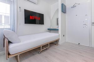 TV a/nebo společenská místnost v ubytování Tulii Rooms