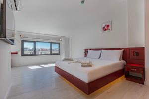 Postel nebo postele na pokoji v ubytování Tulii Rooms