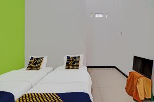 Ένα ή περισσότερα κρεβάτια σε δωμάτιο στο Hotel O Lucky Guesthouse +19 φωτογραφίες