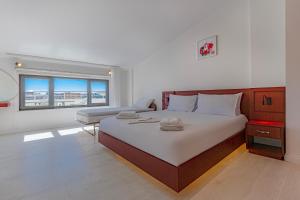Postel nebo postele na pokoji v ubytování Tulii Rooms