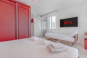 Postel nebo postele na pokoji v ubytování Tulii Rooms
