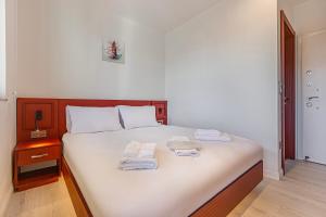 Postel nebo postele na pokoji v ubytování Tulii Rooms