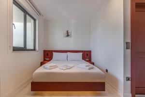 Postel nebo postele na pokoji v ubytování Tulii Rooms