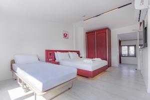 Postel nebo postele na pokoji v ubytování Tulii Rooms
