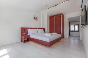 Postel nebo postele na pokoji v ubytování Tulii Rooms