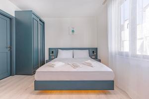 Postel nebo postele na pokoji v ubytování Tulii Rooms