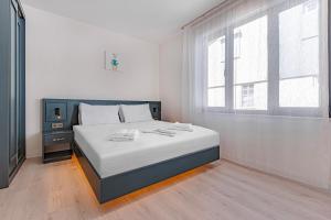 Postel nebo postele na pokoji v ubytování Tulii Rooms