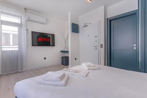 Postel nebo postele na pokoji v ubytování Tulii Rooms