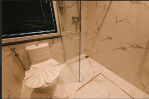Koupelna v ubytování Carrara Hotel Hatyai