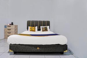 Postel nebo postele na pokoji v ubytování OYO 92269 Arjuna Homestay + 19 fotografií