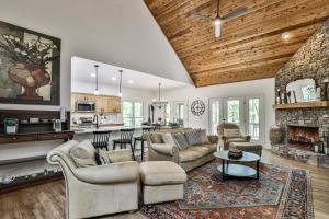 a living room with a couch and a fireplace at Adventures at Big Canoe - Spacious Cabin Rental in Big Canoe - Serene Nature Views, Cozy Fireplace, Spacious Decks, Walking Dist in Afton