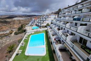 an aerial view of a hotel with a swimming pool at Vista Calma Suite Puerto Rico in Puerto Rico de Gran Canaria