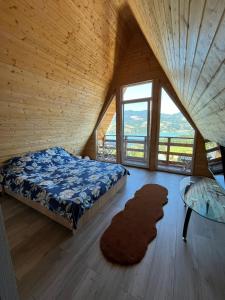 a bedroom with a bed and a glass table at Cricova House in Colibiţa