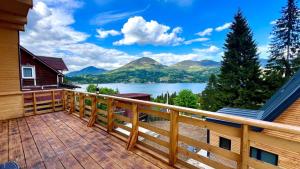 a balcony with a view of a lake and mountains at Cricova House in Colibiţa