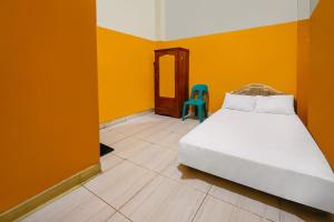 Ένα ή περισσότερα κρεβάτια σε δωμάτιο στο Hotel O Pondokan Tali Super +19 φωτογραφίες