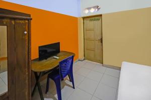 Μια τηλεόραση ή/και κέντρο ψυχαγωγίας στο Hotel O Pondokan Tali Super