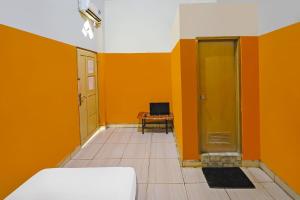 Ένα ή περισσότερα κρεβάτια σε δωμάτιο στο Hotel O Pondokan Tali Super