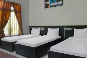 Postel nebo postele na pokoji v ubytování Collection O 92268 Hotel Aero