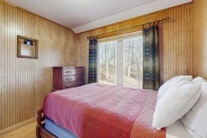 Giường trong phòng chung tại Beach Cottage