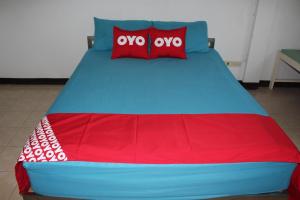 OYO 75420 Howto Hotel客房内的一张或多张床位