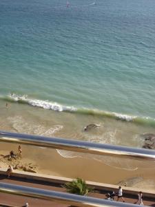 a view of the beach with people on the sand at Atlantic Hôtel & Spa in Les Sables-d'Olonne