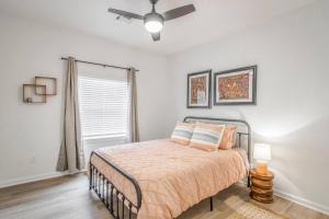 a bedroom with a bed and a ceiling fan at The Arches Walk To Western Ave District in Oklahoma City