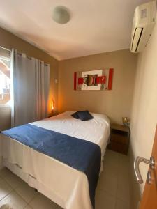 a bedroom with a large bed in a room at Casa Paraiso Beira-Mar in Maracajaú +34 photos