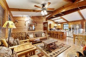 a living room with a couch and a table at Moose Creek Lodge in Sylva