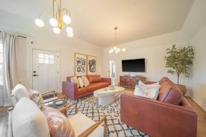 a living room with couches and a tv at New 4 Br, Okc, Walk 2 Ou Med, Sleeps 8, 4 King Bed in Oklahoma City