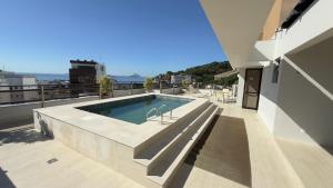 a swimming pool on the roof of a building at Flat Leblon inn in Rio de Janeiro
