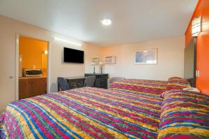 Postel nebo postele na pokoji v ubytování Vali Ho Motel By OYO Weslaco Mercedes