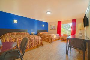 Postel nebo postele na pokoji v ubytování Vali Ho Motel By OYO Weslaco Mercedes