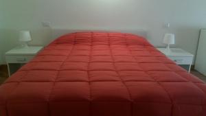 En eller flere senge i et værelse på Casa Vacanze Marhouse