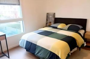 a bedroom with a large bed with a window at Professionnels de Thiais, Rungis, Choisy in Thiais