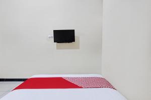 Μια τηλεόραση ή/και κέντρο ψυχαγωγίας στο Hotel O Solo near Solo Safari formerly RR Guesthouse +19 φωτογραφίες