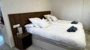A bed or beds in a room at El nido del amá